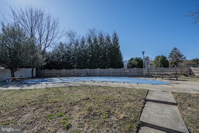 view of swimming pool with a fenced in pool, a patio, and a fenced backyard