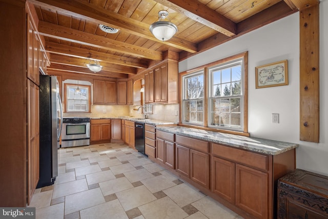 kitchen featuring beamed ceiling, tasteful backsplash, appliances with stainless steel finishes, light stone countertops, and wood ceiling