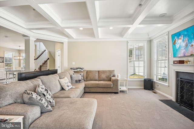 living area featuring coffered ceiling, a fireplace with flush hearth, stairway, beam ceiling, and carpet