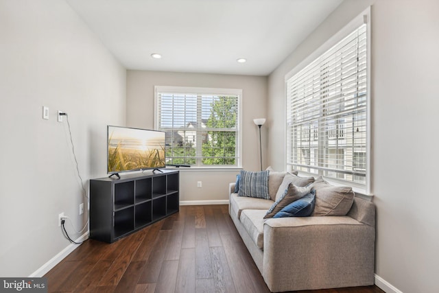 living area featuring dark wood-style flooring, recessed lighting, and baseboards