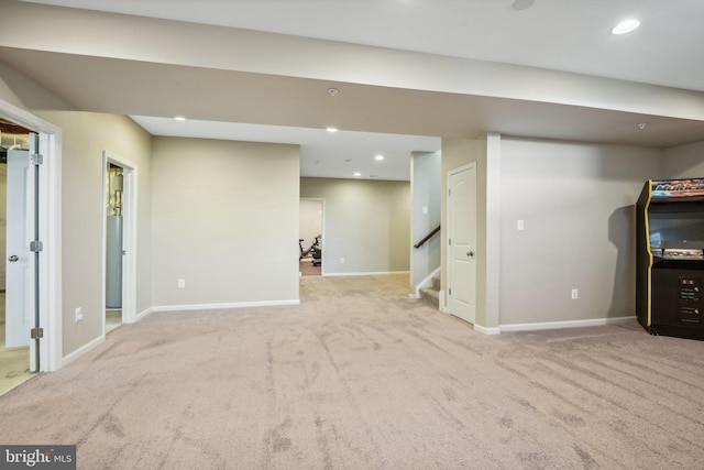 finished basement featuring baseboards, stairway, carpet flooring, and recessed lighting