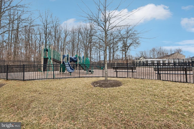 community play area with a yard and fence