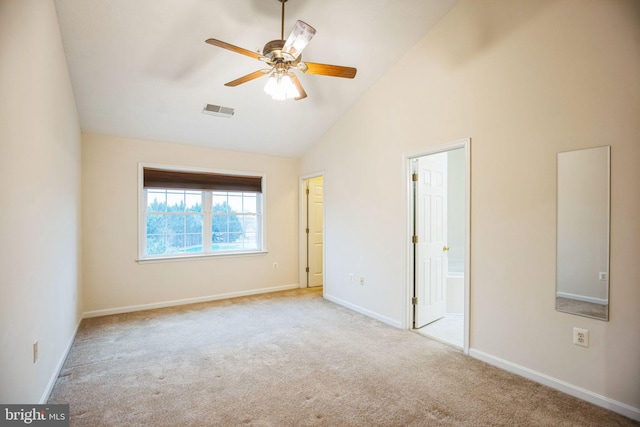 unfurnished bedroom featuring visible vents, high vaulted ceiling, connected bathroom, carpet flooring, and baseboards