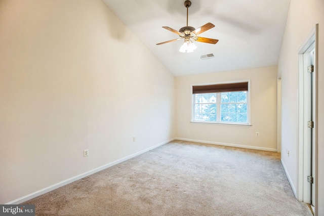 unfurnished bedroom featuring baseboards, visible vents, light carpet, and lofted ceiling