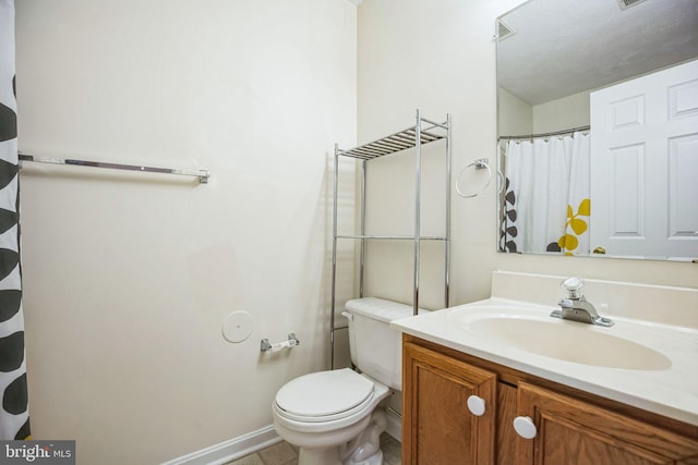 full bath with baseboards, toilet, and vanity