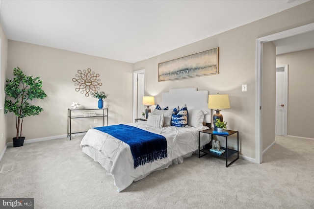 carpeted bedroom with baseboards