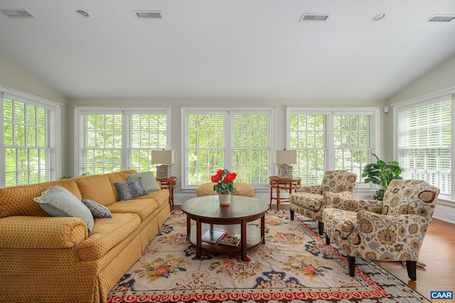 sunroom / solarium with vaulted ceiling and visible vents