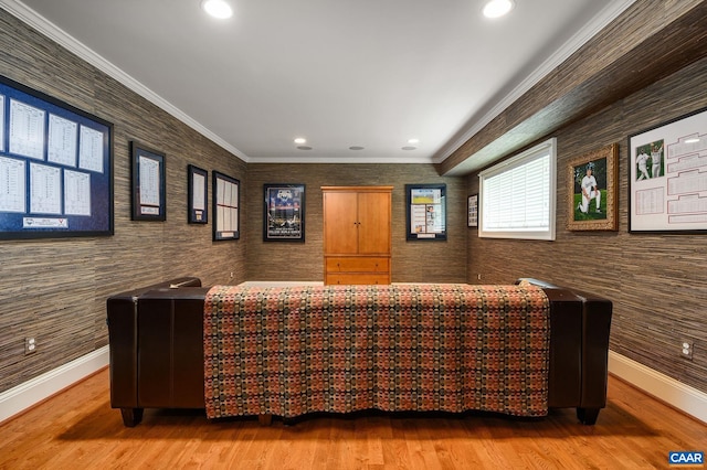 interior space featuring ornamental molding, wood finished floors, and baseboards