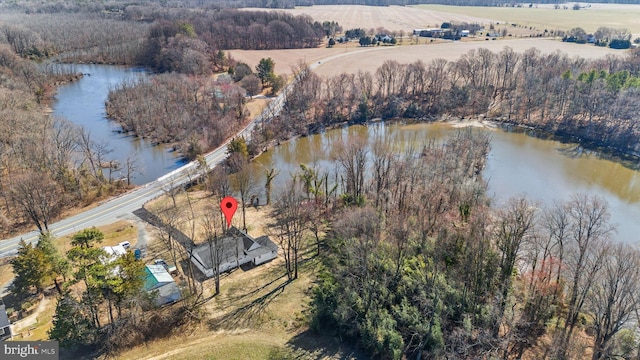 drone / aerial view with a rural view and a water view