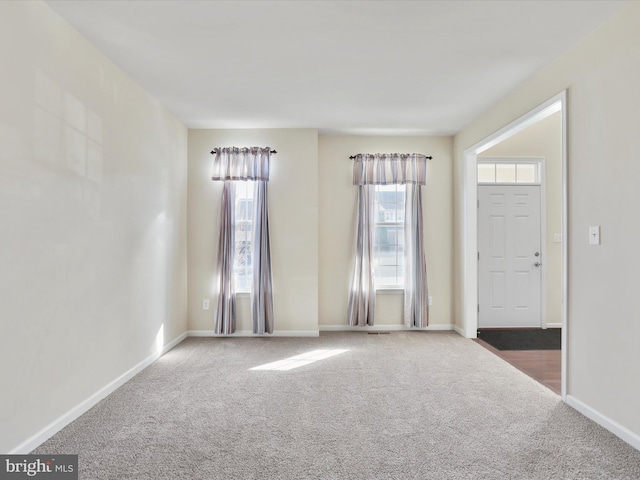 interior space featuring baseboards