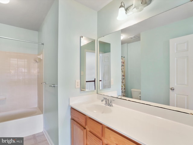 bathroom with visible vents, shower / bath combo, vanity, and toilet