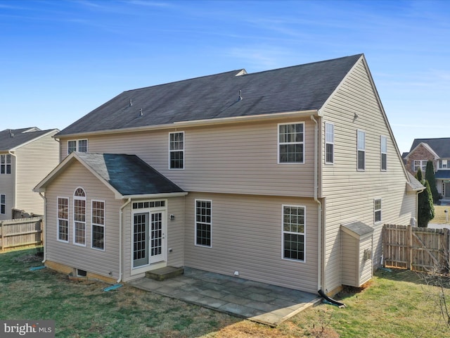 back of house with a lawn, a patio area, and fence