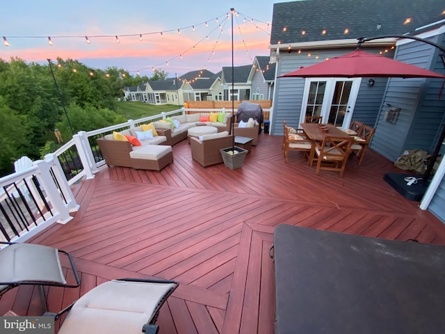 wooden terrace with a residential view, french doors, and outdoor lounge area