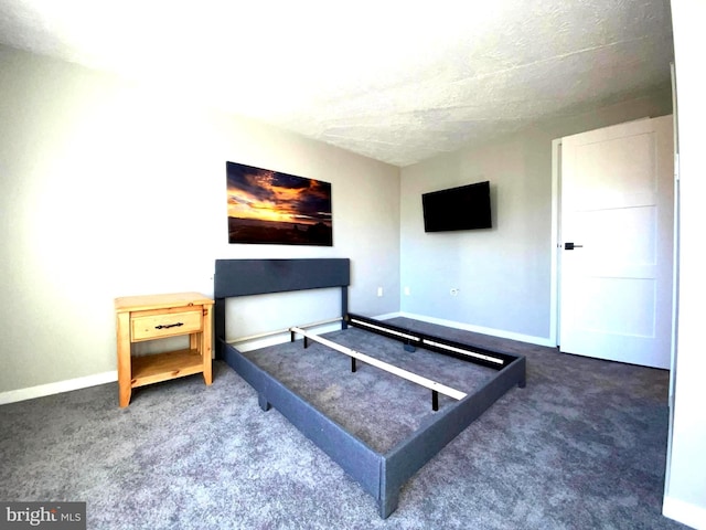 carpeted bedroom featuring baseboards