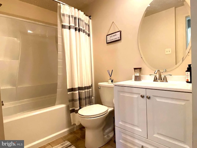 bathroom with toilet, shower / tub combo, and vanity