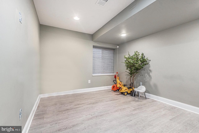 game room featuring visible vents, baseboards, and wood finished floors