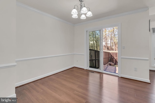 unfurnished dining area with visible vents, crown molding, and wood finished floors