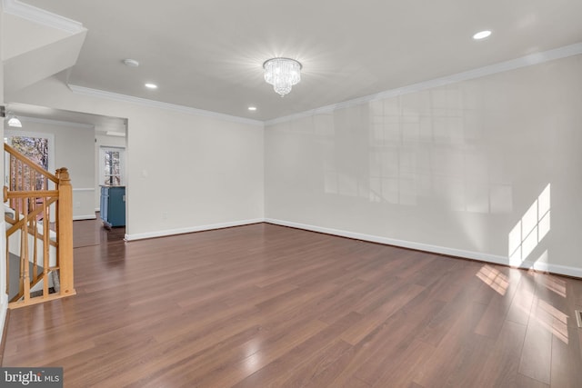 interior space with ornamental molding, stairs, baseboards, and wood finished floors