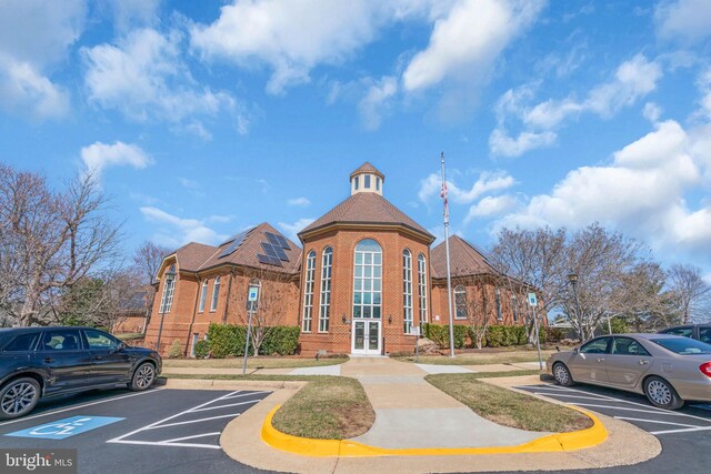 view of property with uncovered parking