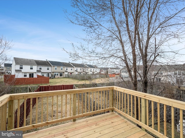 deck featuring a residential view and fence