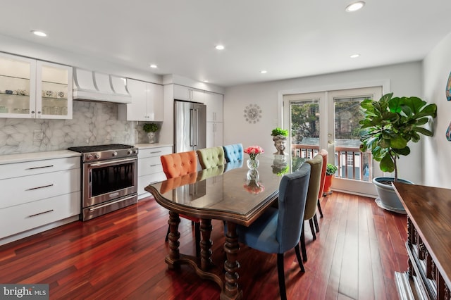 dining area with dark wood-style floors, recessed lighting, and french doors