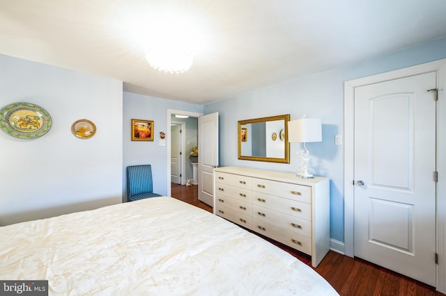 bedroom featuring dark wood-type flooring