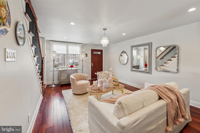 living room with dark wood-style floors, stairway, baseboards, and recessed lighting