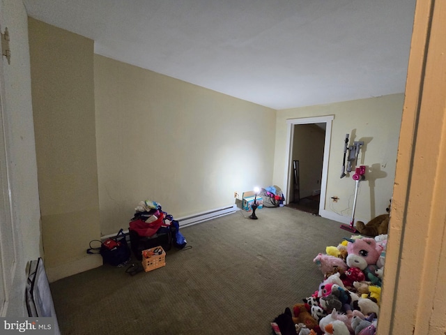 recreation room featuring a baseboard radiator and carpet