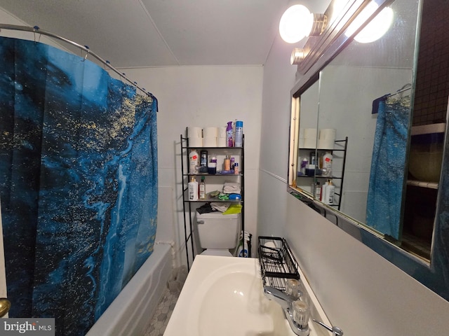 bathroom with a sink, toilet, and shower / bathtub combination with curtain