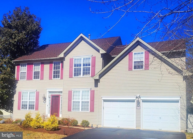 view of front of property featuring driveway and an attached garage