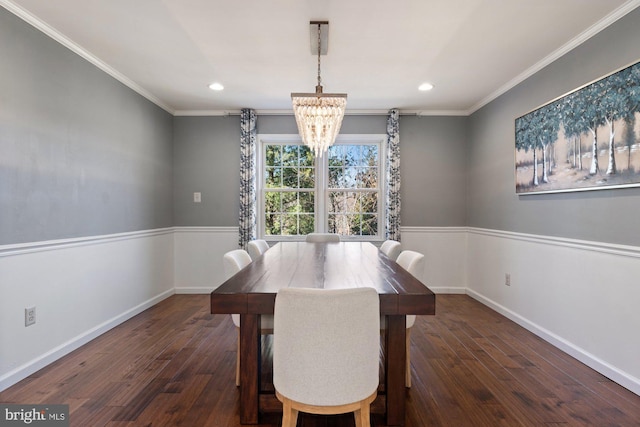 dining area featuring an inviting chandelier, wood-type flooring, ornamental molding, and baseboards