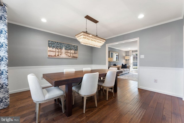 dining room featuring baseboards, dark wood-type flooring, recessed lighting, and crown molding