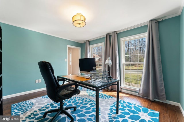 office space featuring ornamental molding, plenty of natural light, wood finished floors, and baseboards