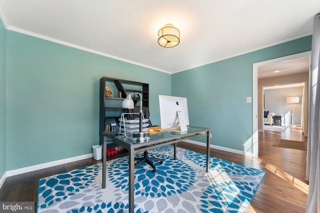 office featuring ornamental molding, hardwood / wood-style floors, and baseboards