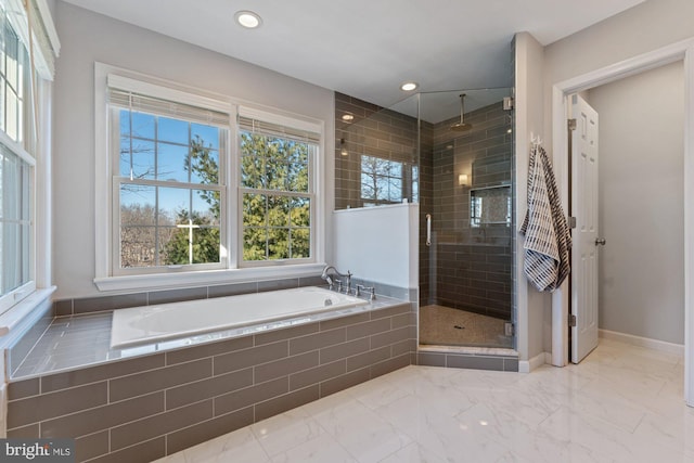 bathroom featuring a stall shower, baseboards, a garden tub, marble finish floor, and recessed lighting