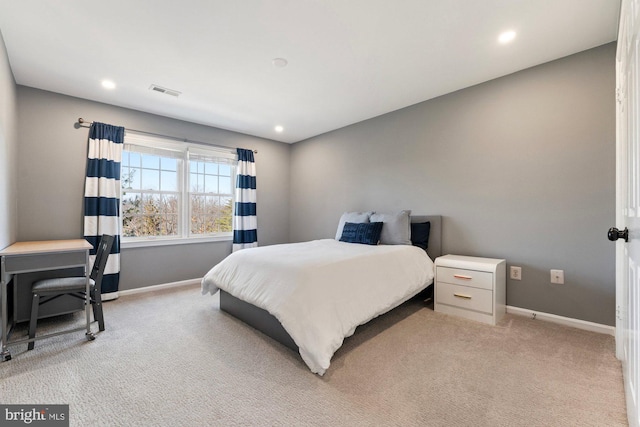 bedroom featuring visible vents, recessed lighting, light colored carpet, and baseboards