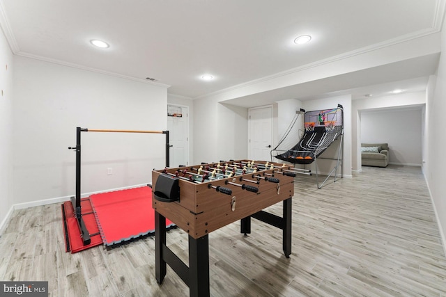 game room with ornamental molding, recessed lighting, wood finished floors, and baseboards