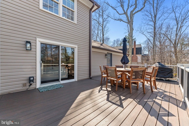 wooden deck with outdoor dining space