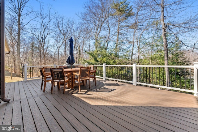 deck with outdoor dining area