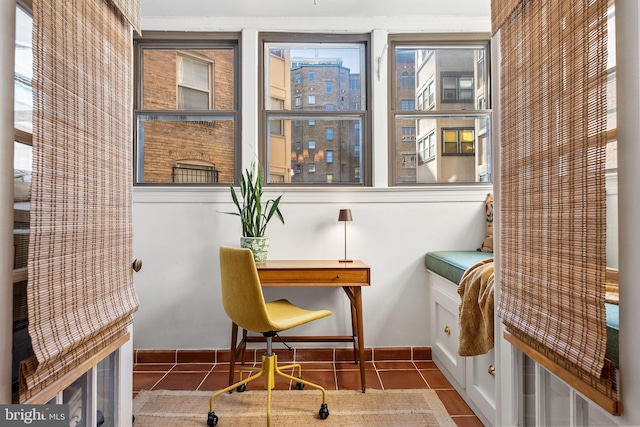 home office with a city view and tile patterned floors