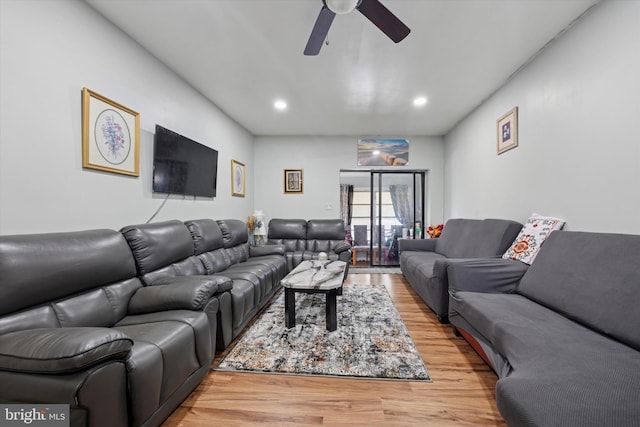 living area featuring recessed lighting, a ceiling fan, and light wood finished floors