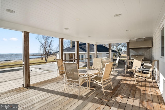 wooden deck with a water view