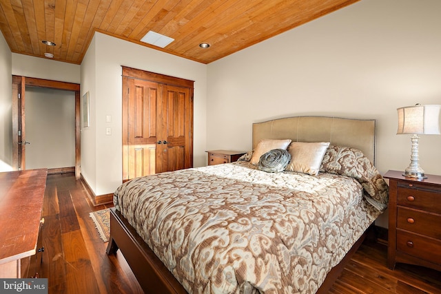 bedroom featuring dark wood-style floors, wood ceiling, and baseboards