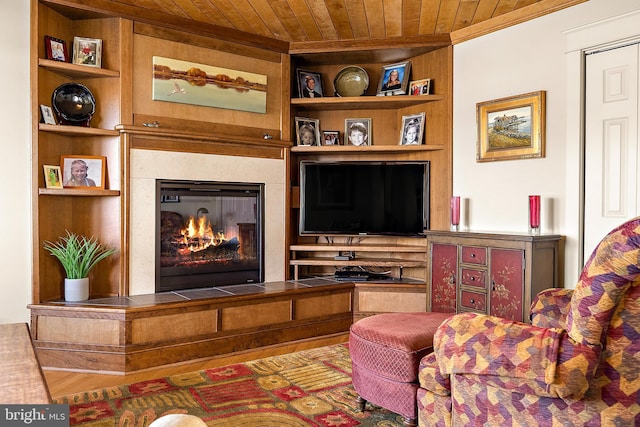 sitting room featuring a high end fireplace, wood ceiling, and built in features