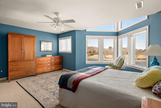 bedroom featuring carpet flooring, visible vents, ceiling fan, and baseboards