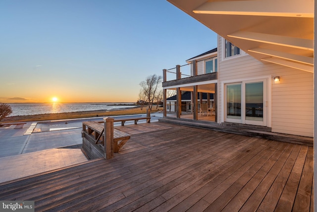 wooden deck with a water view