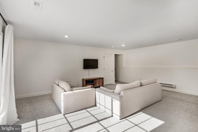 carpeted living room with baseboards, a baseboard heating unit, and recessed lighting