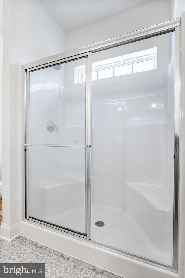 bathroom featuring a shower stall