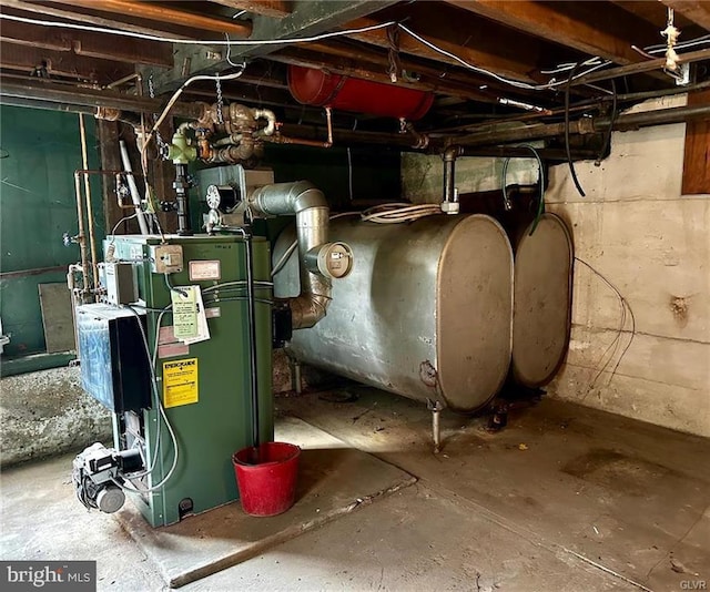 utility room featuring a heating unit and heating fuel