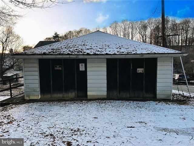 view of snow covered garage